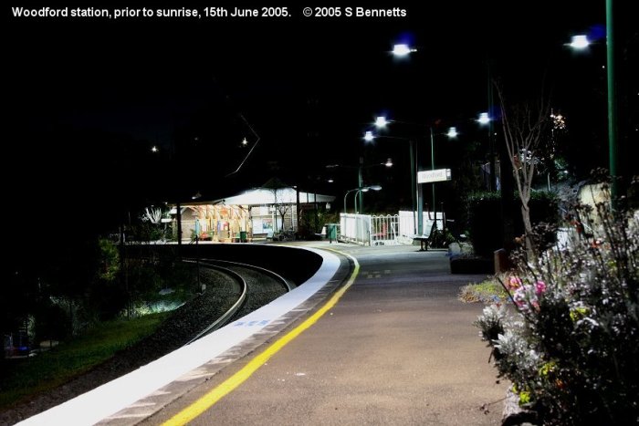 A night shot taken from the western end of platform 1 looking east down the Up main towards Sydney.